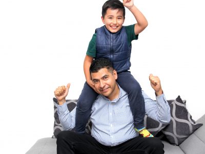 Latino dad plays with his son with autism