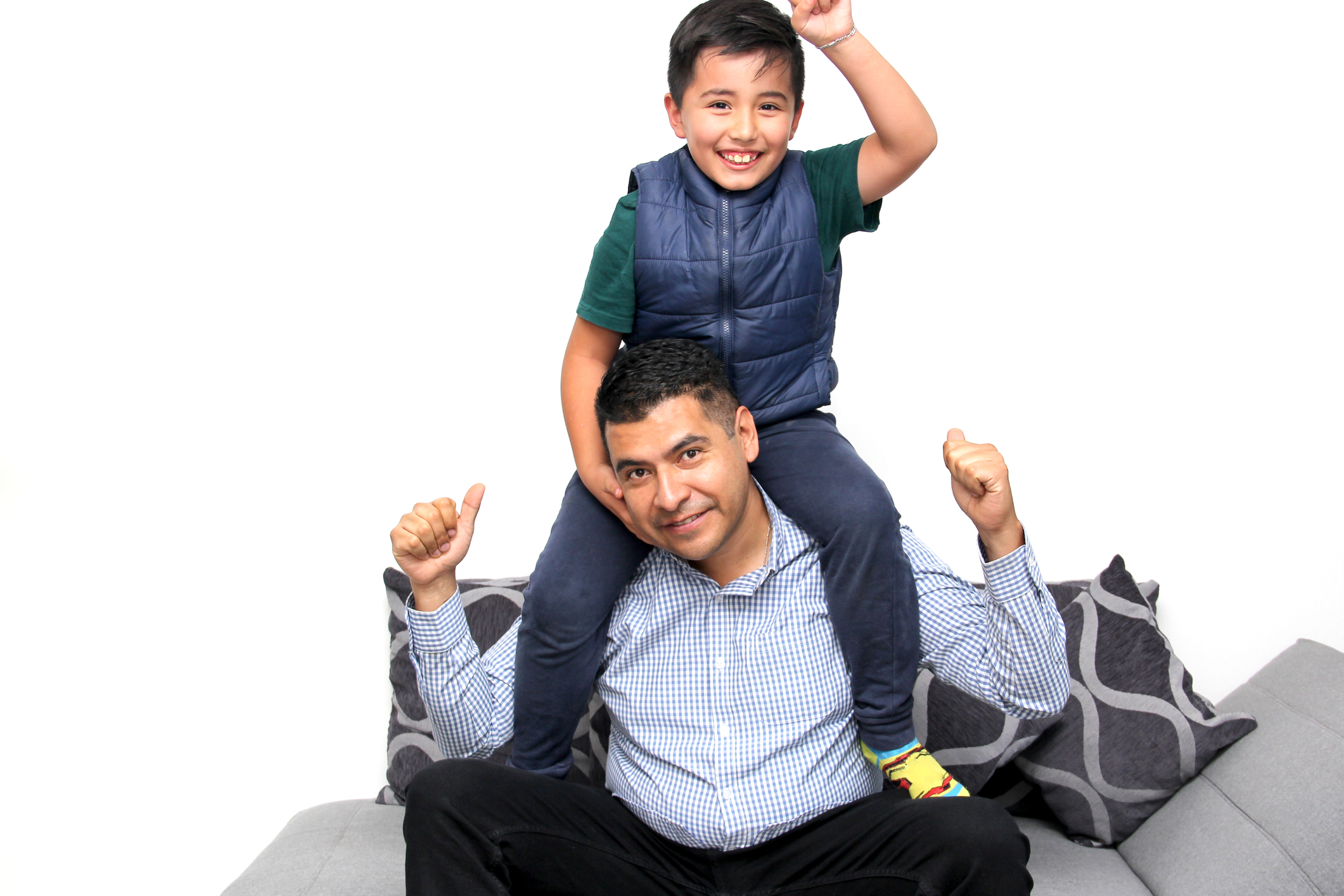 Latino dad plays with his son with autism